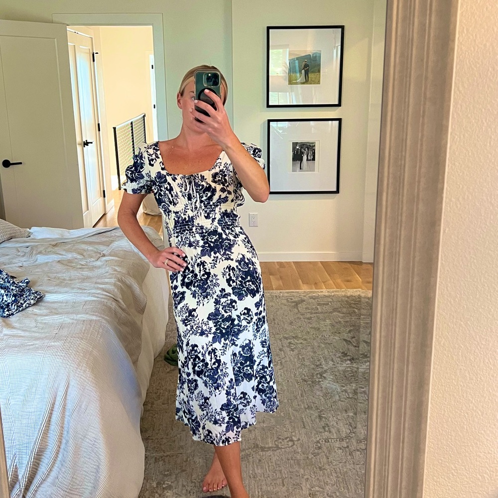 Reformation Dress Size Small. Navy Blue floral midi dress with sleeves.